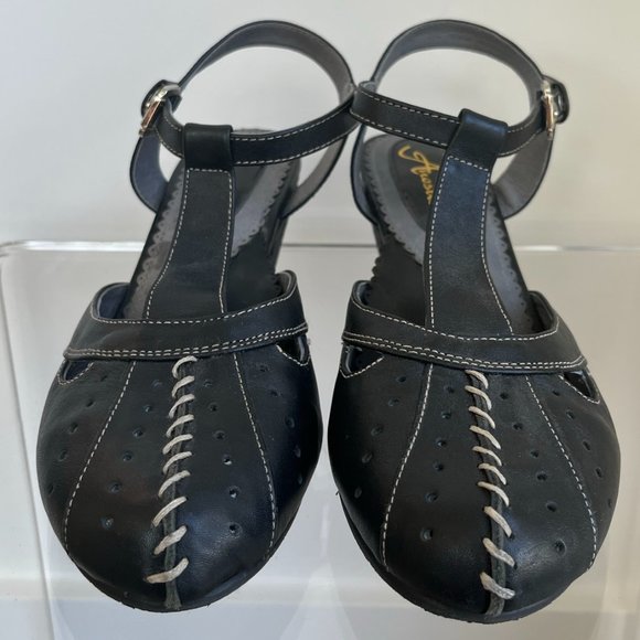 Anesha close toed black shoes with tan accent. - Picture 1 of 12
